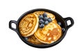 Pancakes with fresh blueberries and maple syrup in a pan. Isolated on white background. Top view. Royalty Free Stock Photo
