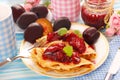 Pancakes with fresh plum`s confiture Royalty Free Stock Photo