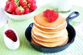 Pancakes with fresh strawberry in a small pan Royalty Free Stock Photo