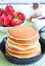 Pancakes with fresh strawberry in a small pan Royalty Free Stock Photo