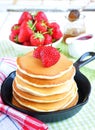 Pancakes with fresh strawberry in a small pan Royalty Free Stock Photo