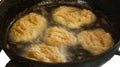 Pancakes are fried in oil in a frying pan. food, potato pancakes, dish Royalty Free Stock Photo