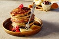 Pancakes with frozen raspberries and banana slices