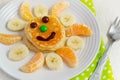 Pancakes with fruit and jam for the children. Breakfast concept