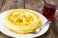 Pancakes and fruit tea with cinnamon Royalty Free Stock Photo