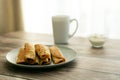 Pancakes on a gray plate, a cup on a wooden table Royalty Free Stock Photo