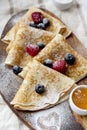 Pancakes with honey and berries