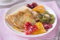 Pancakes with honey and heart shaped oranges and kiwi Royalty Free Stock Photo