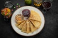 Pancakes with honey, jam and candied fruit Royalty Free Stock Photo