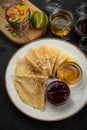 Pancakes with honey, jam and candied fruit Royalty Free Stock Photo