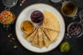 Pancakes with honey, jam and candied fruit Royalty Free Stock Photo