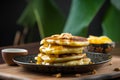 Pancakes with honey, nuts and condensed milk on wooden background. Royalty Free Stock Photo