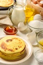 Pancakes and ingredients for making pancakes Royalty Free Stock Photo