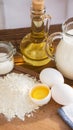 Pancakes ingredients. Milk egg flour oil sugar. Wooden background Royalty Free Stock Photo