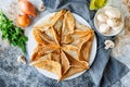 Arabic kataef pancakes stuffed with fried champignons and onions on a white plate Royalty Free Stock Photo