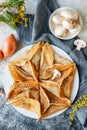 Arabic kataef pancakes stuffed with fried champignons and onions on a white plate Royalty Free Stock Photo