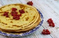 Pancakes made of whole weat flour with fresh berries on light blue wooden background, selective focus. Healthy breakfast concept. Royalty Free Stock Photo
