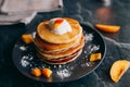 Pancakes with peaches, cream and honey
