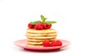 Pancakes with raspberries on a pink plate Royalty Free Stock Photo