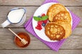 Pancakes with raspberry, blueberry, milk and honey syrup Royalty Free Stock Photo