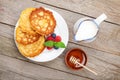 Pancakes with raspberry, blueberry, milk and honey syrup Royalty Free Stock Photo