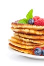 Pancakes with raspberry, blueberry, mint and honey syrup Royalty Free Stock Photo