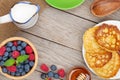 Pancakes with raspberry, blueberry, mint and honey syrup Royalty Free Stock Photo