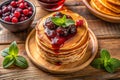 Pancakes with raspberry jam and raspberries on wooden background. Ai generated Royalty Free Stock Photo