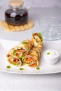 Pancakes with salmon (trout), sour cream, greenstuff and tea. Thin, not sweet blinchiki stuffed with red fish. Royalty Free Stock Photo