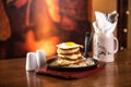 Pancakes with sausage and scrambled eggs in a frying pan