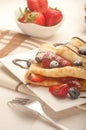 Pancakes served with strawberries, blueberries and chocolate Royalty Free Stock Photo