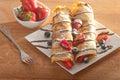 Pancakes served with strawberries, blueberries and chocolate Royalty Free Stock Photo