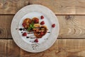 Pancakes in the shape of hearts with raspberries