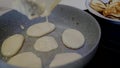 Pancakes sizzle in hot oil