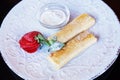 Pancakes with sour cream, strawberries close-up Royalty Free Stock Photo