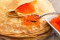 Pancakes with a spoon of red caviar