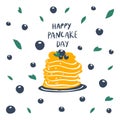 Pancakes stack with berries on plate and freehand drawn quote: happy pancake day