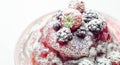 Pancakes stack with strawberries, blueberries, and blackberries, topped with sauce and sprinkled with powdered sugar Royalty Free Stock Photo