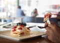 Pancakes with stawberries and cream ,the best breakfast for children and adults . Man eats dessert. Healthy eating for lunch . Clo Royalty Free Stock Photo