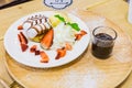 Pancakes with Strawberry and Vanilla Ice cream with chocolate to Royalty Free Stock Photo