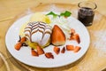 Pancakes with Strawberry and Vanilla Ice cream with chocolate to Royalty Free Stock Photo