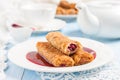 Pancakes stuffed with cherries and cherry sauce Royalty Free Stock Photo