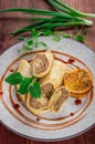 Pancakes stuffed with liver. Wooden rustic background. Top view