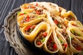 Pancakes stuffed with meat beef, peppers and onions closeup. horizontal Royalty Free Stock Photo