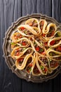 Pancakes stuffed with meat beef, peppers and onions closeup. Vertical top view Royalty Free Stock Photo