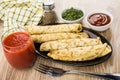 Pancakes with stuffing in dish, fork, dill and ketchup Royalty Free Stock Photo