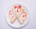 pancakes with sugar powder on white background