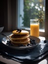 Pancakes with syrup and blueberries on top morning. A plate of pancakes with blueberries and syrup Royalty Free Stock Photo