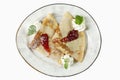 Pancakes with syrup and ice cream on a plate. Appetizing dessert. Top view. Isolated over white background