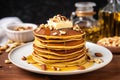 pancakes topped with golden pats of butter and nuts